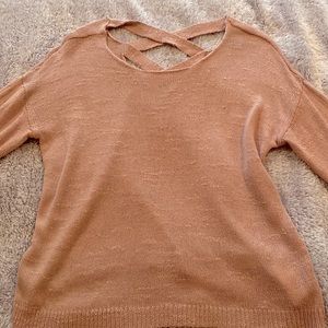 woman’s pink sweater